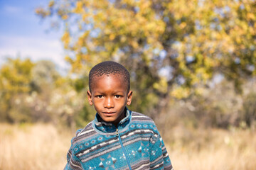portrait of  a village african child in the bush