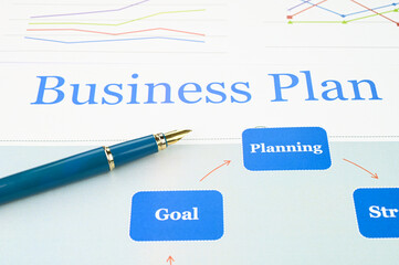 Business plan document with fountain pen.