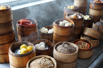 Fototapeta na wymiar Dim sum is a large range of small Cantonese dishes that are traditionally enjoyed in restaurants for brunch. Most modern dim sum dishes are commonly associated with Cantonese cuisine, although dimsum.