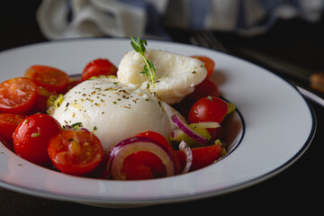 Salad with cherry tomatoes and burrata