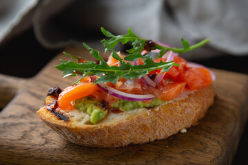 Bruschetta with cream cheese, avocado and trout