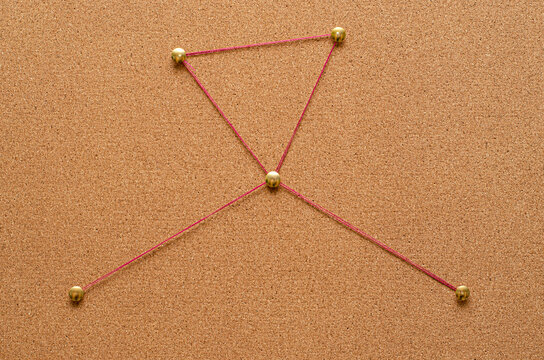 Corkboard detective with pins and thread