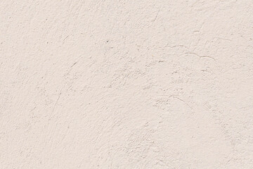 An old plaster cement wall, beige abstract background. Concrete grunge texture - obrazy, fototapety, plakaty
