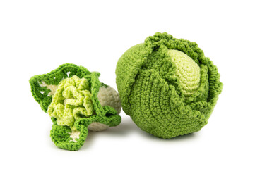An artificial head of green and cauliflower knitted from thick yarn