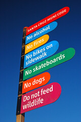 The Rules of Santa Cruz, California are posted on a colorful, public sign to inform people what is...