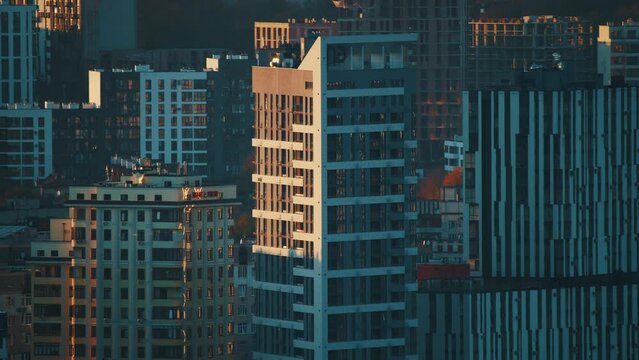 Sunlight falling on skycrapers. The first rays of the sun touching the big city. Urban concept.
