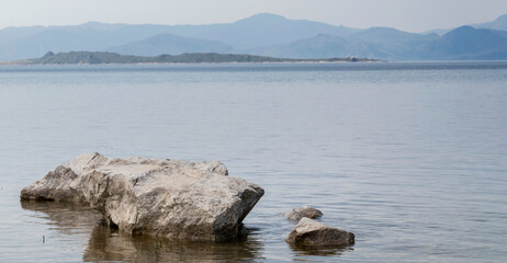 lake among hilly area with stones