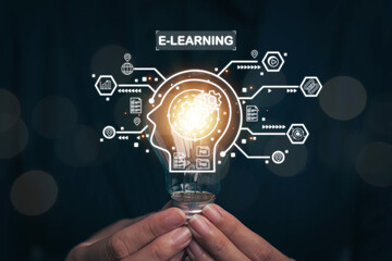 Light bulb in hand that glows. The concept of learning, self-study with online systems through the Internet network, e-learning education, Internet lessons, field trips