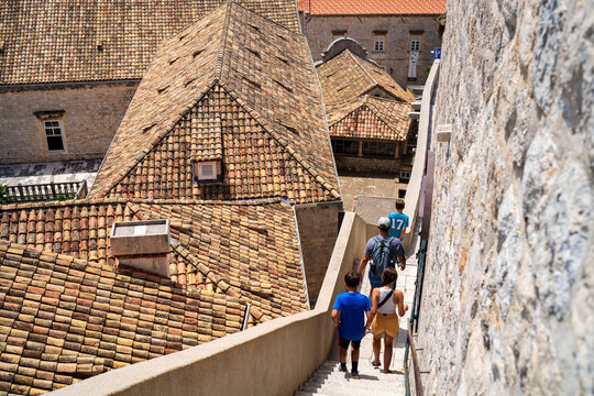 Family walking the city wall in the old town of Dubrovnik Croatia