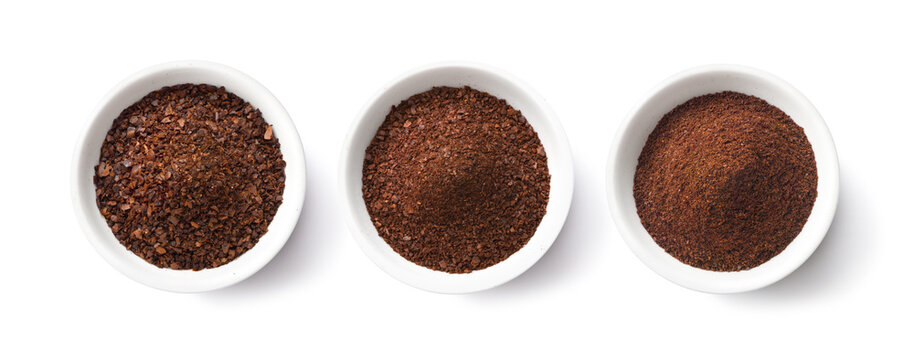 Flat lay of Different types of grinds coffee in white bowl isolated on white background. Clipping path.