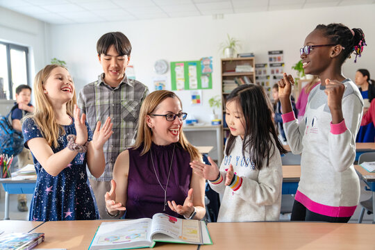 The teacher counselling pupils learning in the classroom