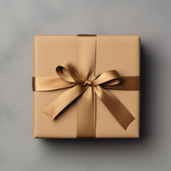 Brown gift box with ribbon bow in top view isolated on gray background