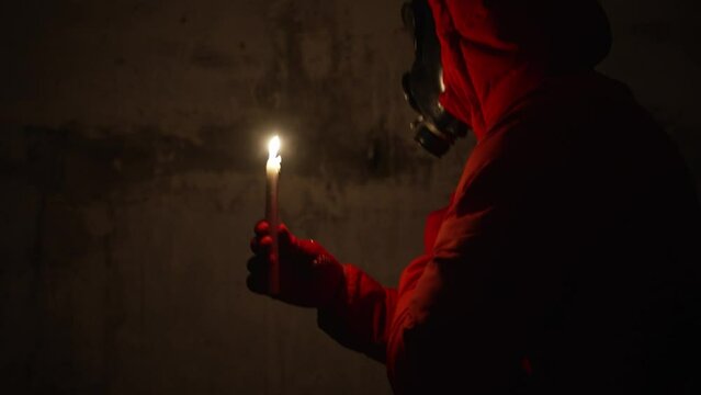 Ukraine war Shelter. Bunker, nuclear war A man in a gas mask protective clothing