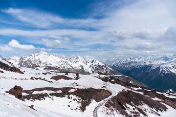 Black volcanic mountains in the snow