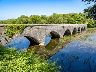 Fototapeta na wymiar Eight-Arch bridge in bosherton lily ponds, Wales