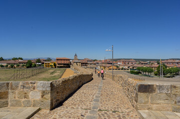 Summer's Awakening: Unveiling the Roman Bridge along the Camino de Santiago in Hospital de Orbigo, Leon, Spain