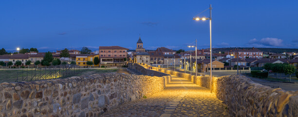 Naklejka premium Summer's Awakening: Unveiling the Roman Bridge along the Camino de Santiago in Hospital de Orbigo, Leon, Spain