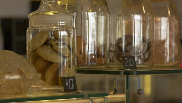 Cookies with a price tag in glass jars in a cafe