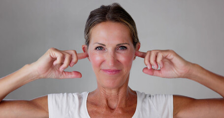 Stressed Woman Covering Ears