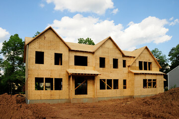 House under construction in the sheathing phase.