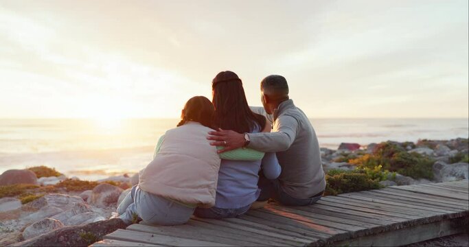 Love, hug and travel with family at beach for relax, embrace and seaside adventure. Happiness, support and happy with back of parents and child in nature for vacation, sunset and freedom