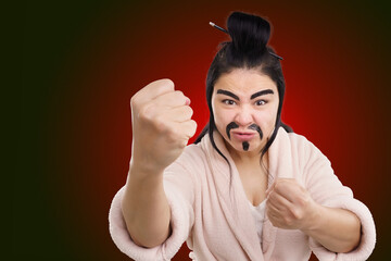 Woman in Chinese martial arts comedy concept. With eyebrows painted and hair dyed black, she...