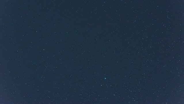 Starry night, time lapse with summer stars, constellations and the Milky Way. The star Vega rises into the sky