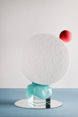 dimensional compositions of geometric shapes concept. transparent cube with circles and slime on blue background. copy space. abstract and still life