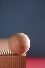 dimensional compositions of geometric shapes concept. wooden circle on texture box on blue...