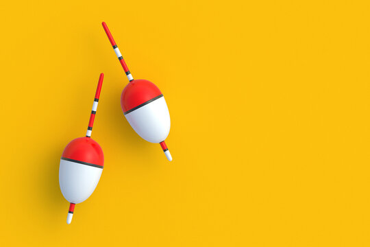 Fishing floats on orange background. Accessories for hobby and leisure. Top view. Copy space. 3d render