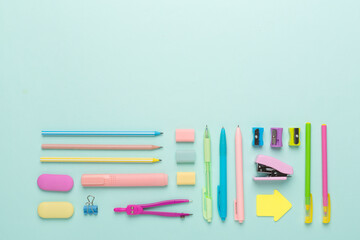 Flat lay with colorful school stationery on color backgroung, top view - obrazy, fototapety, plakaty