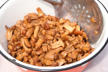Sauteed mushrooms for cooking. Potatoes with chanterelles, recipe. Close-up.