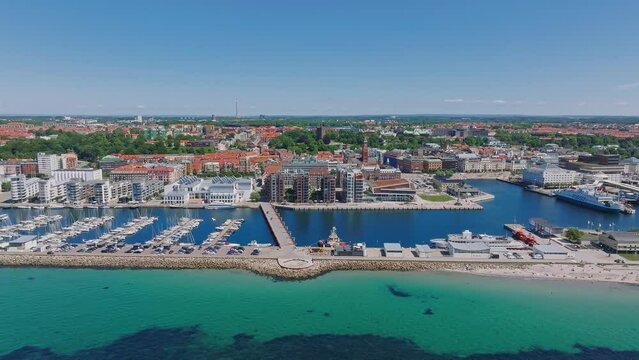 View of the Helsinborg city centre and the port of Helsingborg in Sweden. Old town by the beach and city port in Helsingborg harbour. Beautiful aerial view.