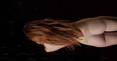 sexy slim fit lady washing body. Young red-haired woman taking shower. Backside rare vertical view of woman in swimsuit takes rain shower Slow motion beauty of body wellness health and body care - Powered by Adobe