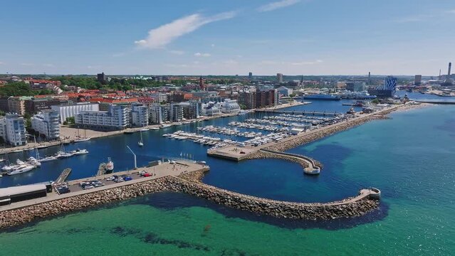 View of the Helsinborg city centre and the port of Helsingborg in Sweden. Old town by the beach and city port in Helsingborg harbour. Beautiful aerial view.