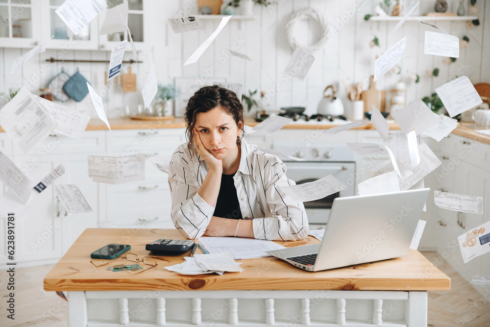 Wall mural stressed woman trying to deal with financial documents, having problem to find money to pay utility 