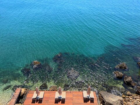 Turquoise blue ocean water and paradise beach on rocky coast