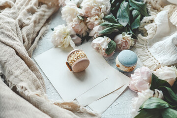 Sweet macarons and white peonies, beautiful photo
