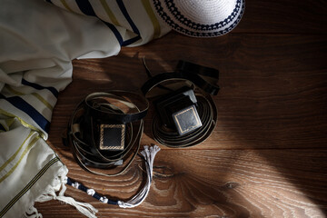 A photograph of ritual Jewish objects Tefillin, Tallit, Kippah.