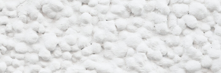 The texture of the gray wall. Decorative plaster.  Rough grainy bumpy surface. Perfect for background and design. Closeup.