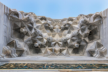 Muqarnas of the entrance of Bayezid II Mosque at Istanbul, Turkey with Ottoman inscriptions.