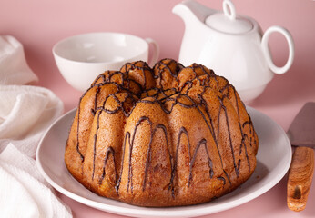 cake with smudges of chocolate on a round plate