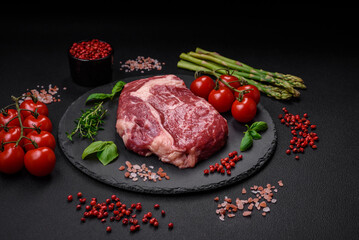Fresh, raw beef steak with salt, spices and herbs