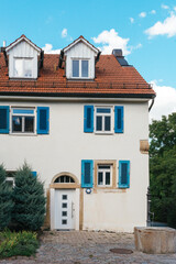 Traditional small house with beautiful outdoor decor facade in Germany. German old brick building house ancient European city German architect