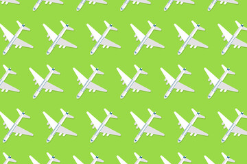 Creative composition made with passenger plane on pastel blue background. Summer travel or vacation pattern.
