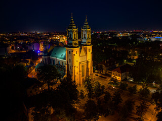 Aerial drone view of Cathedral Basilica of Saints Peter and Paul in Poznan Ostrow Tumski in night