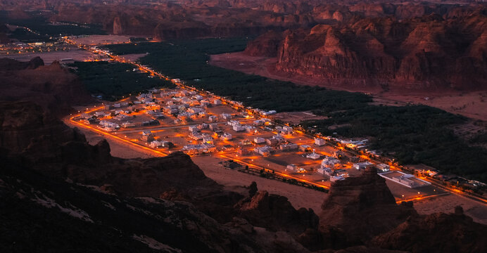 A town with lights at sunset. An image from Al Ula, Saudi Arabia.