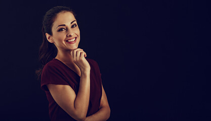 Beautiful business toothy enjoying laughing woman with long brown healthy hair style in dark red shirt clothing. Closeup