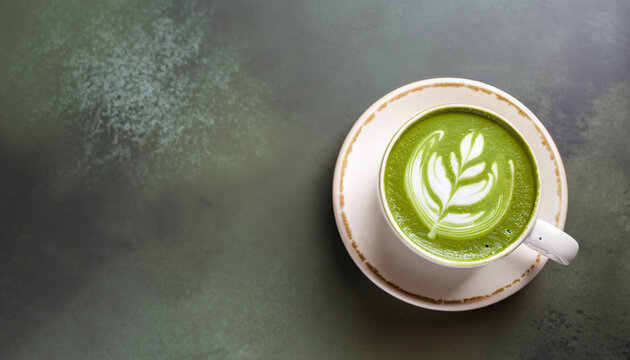 Matcha green tea latte in a cup. Top view. Copy space.