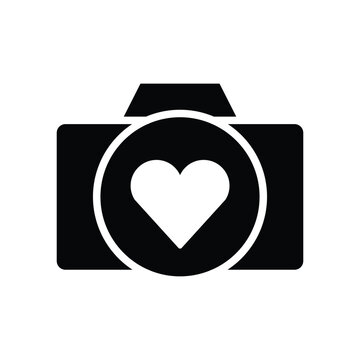 Photo camera with heart symbol on lens glyph icon vector. Like, favourite symbol camera icon. Vector illustration glyph pictogram for infographic interface or design graphic.